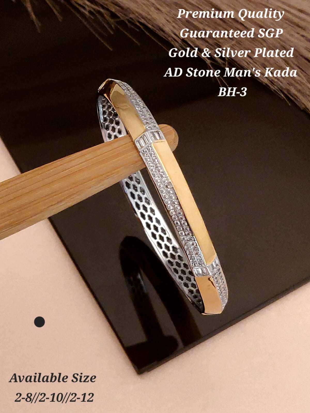 Gold and silver kada with baguette stone, close-up