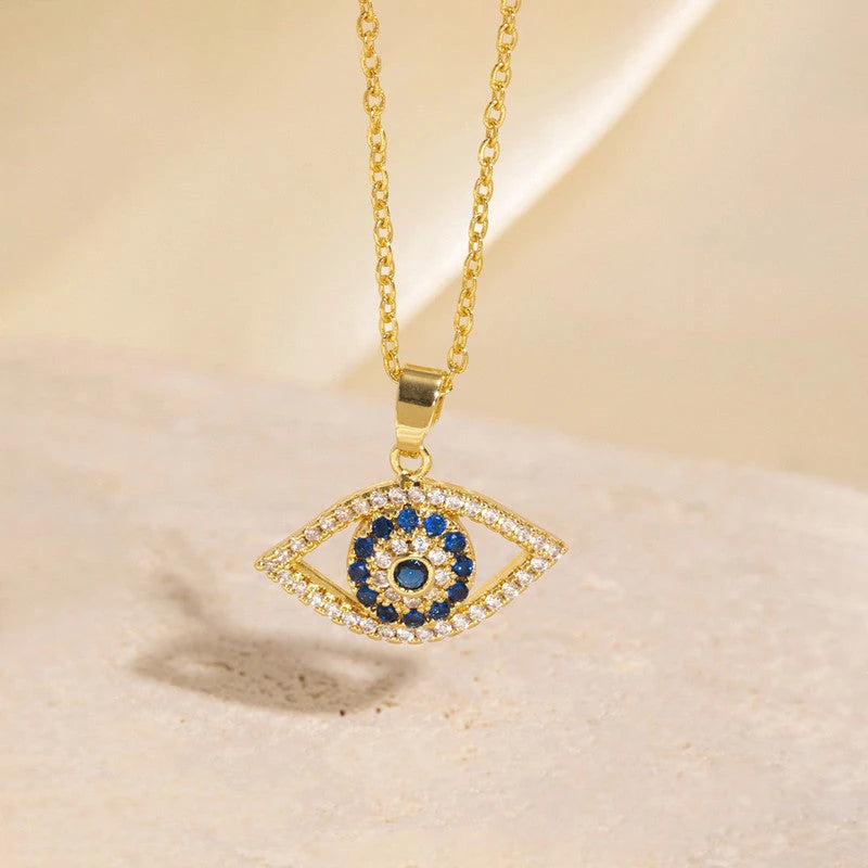 Evil eye pendant hanging over a stone display