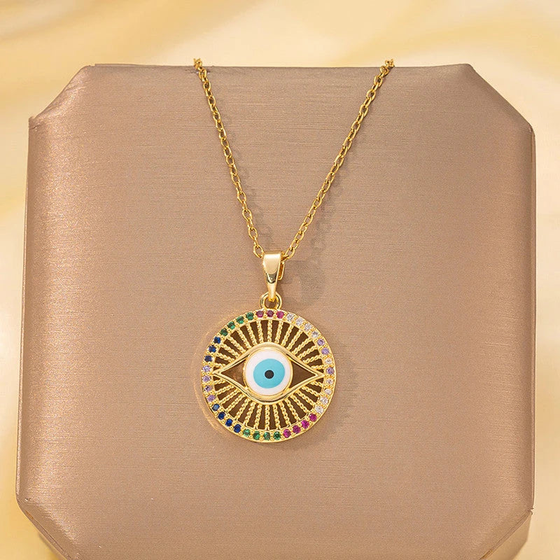 Front view of the round evil eye pendant on a display box