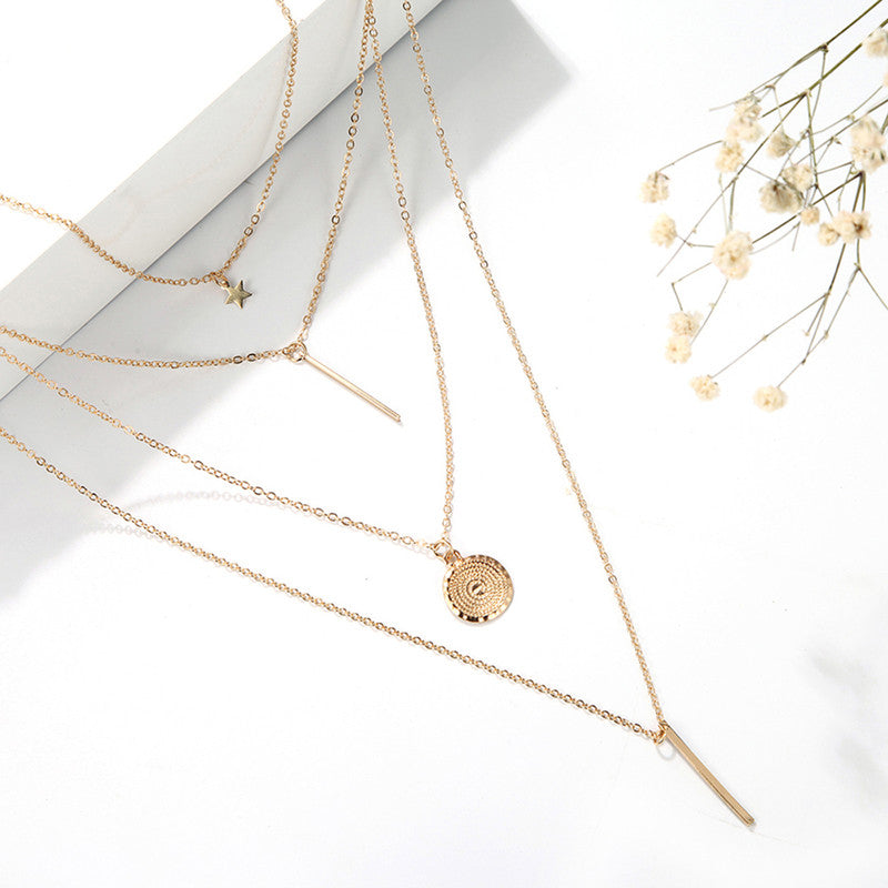 Gold-Tone Star & Coin Four-Layer Necklace