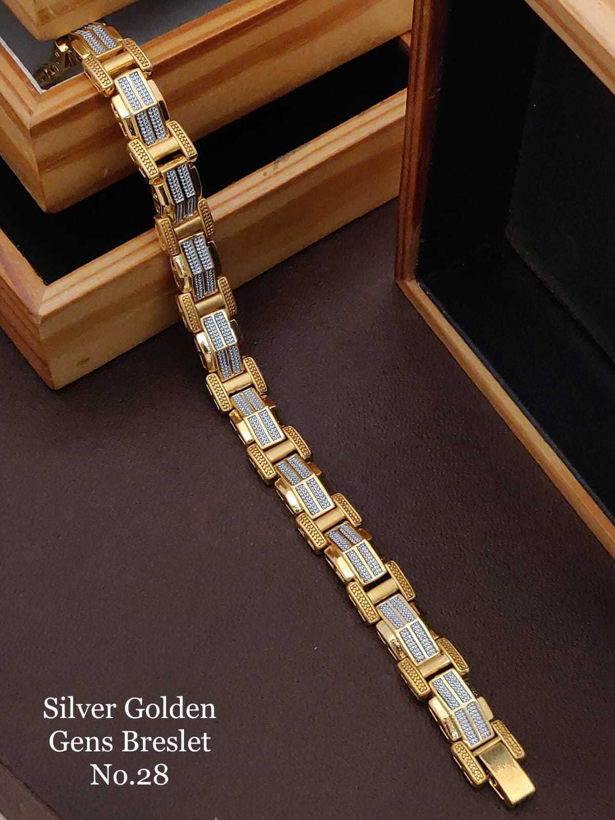 Silver and gold two-tone link bracelet on a wooden box