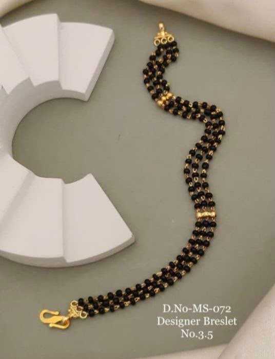 Three-Row Black Bead Bracelet with Gold Spacers